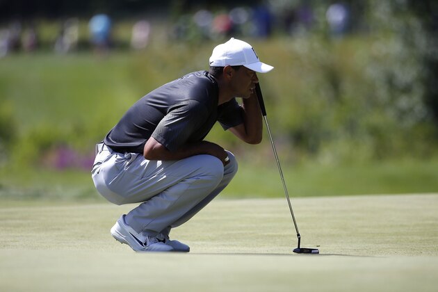 Tiger Woods lines up a putt on the fifth hole during the third round of the Dell Technologies Championship golf tournament at TPC Boston in Norton, Mass., Sunday, Sept. 2, 2018. (AP Photo/Michael Dwyer)