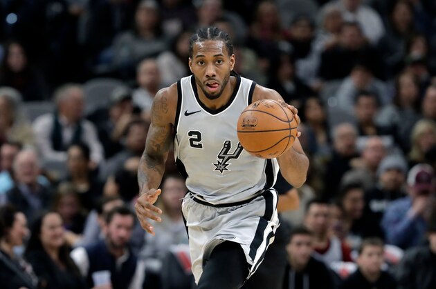 FILE - In this Jan. 13, 2018, file photo, San Antonio Spurs forward Kawhi Leonard (2) moves the ball up court during the second half of an NBA basketball game against the Denver Nuggets, in San Antonio. General manager R.C. Buford acknowledges star forward Kawhi Leonard is unhappy with the Spurs. He remains optimistic the relationship can be salvaged. (AP Photo/Eric Gay, File)