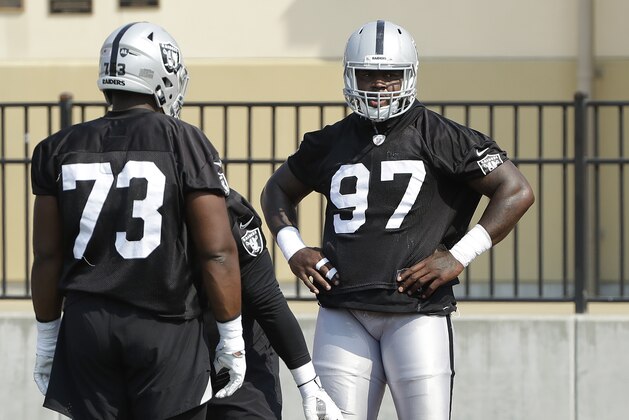 Oakland Raiders' Marcus Hurst (73) and Mario Edwards Jr. during NFL football practice in Napa, Calif., Saturday, July 28, 2018. (AP Photo/Jeff Chiu)