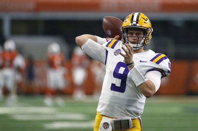 LSU quarterback Joe Burrow (9) throws during warmups before playing Miami in an NCAA college football game Sunday, Sept. 2, 2018, in Arlington, Texas. (AP Photo/Ron Jenkins)