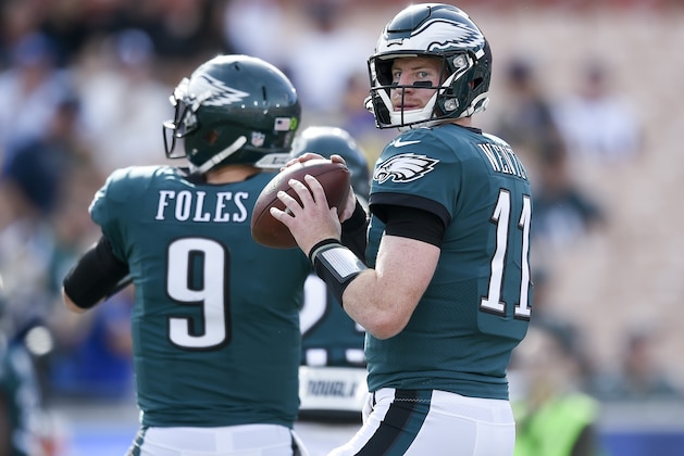 Philadelphia Eagles quarterback Carson Wentz, left, and quarterback Nick Foles warm up before an NFL football game against the Los Angeles Rams Sunday, Dec. 10, 2017, in Los Angeles. (AP Photo/Kelvin Kuo)