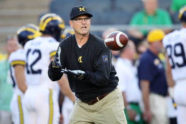 SOUTH BEND, IN - SEPTEMBER 01:  Head coach Jim Harbaugh of the Michigan Wolverines warms up with the team prior to their game against the Notre Dame Fighting Irish at Notre Dame Stadium on September 1, 2018 in South Bend, Indiana.  (Photo by Gregory Shamus/Getty Images)