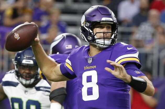 FILE - In this  Friday, Aug. 24, 2018 file photo, Minnesota Vikings quarterback Kirk Cousins (8) throws a pass during the first half of an NFL preseason football game against the Seattle Seahawks in Minneapolis. The Minnesota Vikings have a new quarterback in Kirk Cousins and the same Super Bowl aspiration, after coming within one win of the big game last season. (AP Photo/Bruce Kluckhohn, File)