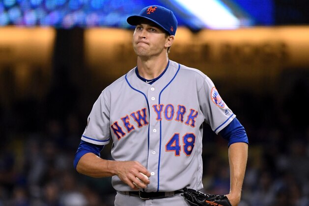 LOS ANGELES, CA - SEPTEMBER 03:  Jacob deGrom #48 of the New York Mets reacts to his pitch to Max Muncy #13 of the Los Angeles Dodgers during the sixth inning at Dodger Stadium on September 3, 2018 in Los Angeles, California.  (Photo by Harry How/Getty Images)
