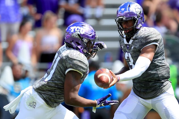 FORT WORTH, TX - SEPTEMBER 01:  Shawn Robinson #3 of the TCU Horned Frogs hands the ball off to Emari Demercado #21 of the TCU Horned Frogs against the Southern University Jaguars in the second quarter at Amon G. Carter Stadium on September 1, 2018 in Fort Worth, Texas.  (Photo by Tom Pennington/Getty Images)