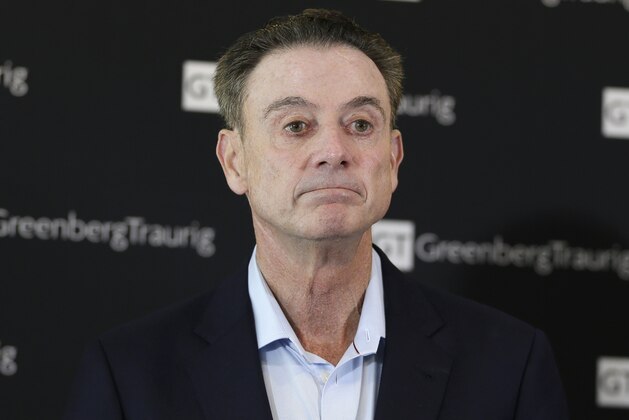 Former Louisville basketball coach Rick Pitino talks to reporters during a news conference in New York, Wednesday, Feb. 21, 2018. Pitino held the news conference in the wake of an NCAA decision in a sex scandal case that strips the Cardinals program of 123 victories, a national championship and $600,000 in post-season revenue. (AP Photo/Seth Wenig)