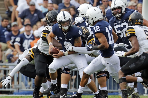 STATE COLLEGE, PA - SEPTEMBER 01:  Trace McSorley #9 of the Penn State Nittany Lions looks to pass to Mac Hippenhammer #12 against MyQuon Stout #92 of the Appalachian State Mountaineers and Trey Cobb #45 of the Appalachian State Mountaineers on September 1, 2018 at Beaver Stadium in State College, Pennsylvania.  (Photo by Justin K. Aller/Getty Images)