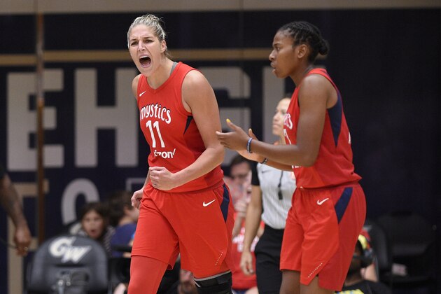 Washington Mystics forward Elena Delle Donne (11) reacts next to Ariel Atkins, right, during the second half of Game 4 of a WNBA basketball playoffs semifinal against the Atlanta Dream, Sunday, Sept. 2, 2018, in Washington. (AP Photo/Nick Wass)