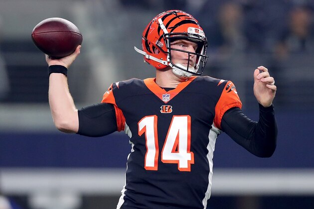 ARLINGTON, TX - AUGUST 18:  Andy Dalton #14 of the Cincinnati Bengals looks for an open receiver against the Dallas Cowboys in the first quarter at AT&T Stadium on August 18, 2018 in Arlington, Texas.  (Photo by Tom Pennington/Getty Images)