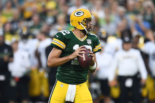 GREEN BAY, WI - AUGUST 16:  Aaron Rodgers #12 of the Green Bay Packers drops back to pass during a preseason game against the Pittsburgh Steelers at Lambeau Field on August 16, 2018 in Green Bay, Wisconsin.  The Packers defeated the Steelers 51-34.  (Photo by Stacy Revere/Getty Images)