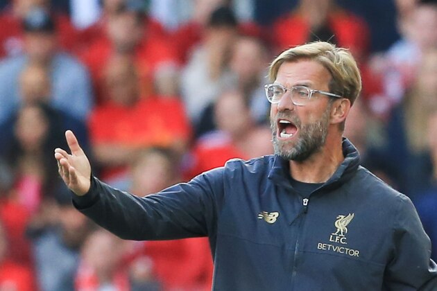 Liverpool's German manager Jurgen Klopp gestures from the touchline during the English Premier League football match between Liverpool and Brighton and Hove Albion at Anfield in Liverpool, north west England on August 25, 2018. (Photo by Lindsey PARNABY / AFP) / RESTRICTED TO EDITORIAL USE. No use with unauthorized audio, video, data, fixture lists, club/league logos or 'live' services. Online in-match use limited to 120 images. An additional 40 images may be used in extra time. No video emulation. Social media in-match use limited to 120 images. An additional 40 images may be used in extra time. No use in betting publications, games or single club/league/player publications. /         (Photo credit should read LINDSEY PARNABY/AFP/Getty Images)