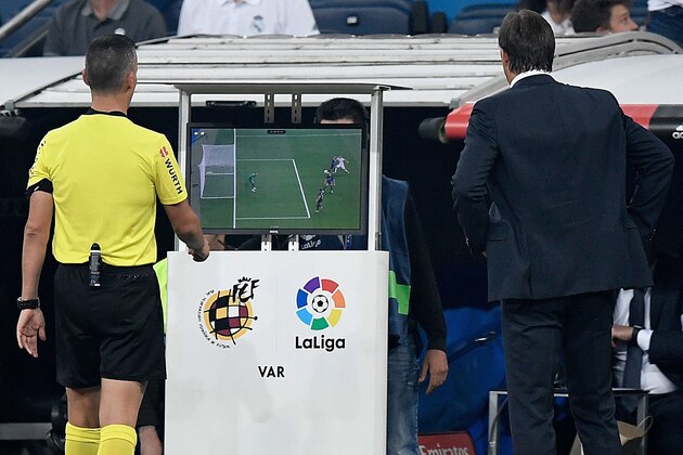 Spanish referee Santiago Jaime Latre (L) and Real Madrid's Spanish coach Julen Lopetegui check the VAR screen during the Spanish league football match between Real Madrid CF and Club Deportivo Leganes SAD at the Santiago Bernabeu stadium in Madrid on September 1, 2018. (Photo by GABRIEL BOUYS / AFP)        (Photo credit should read GABRIEL BOUYS/AFP/Getty Images)