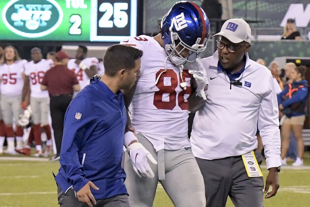 New York Giants tight end Evan Engram (88) is helped off the field after an injury against the New York Jets during the second quarter of a preseason NFL football game, Friday, Aug. 24, 2018, in East Rutherford, N.J. (AP Photo/Bill Kostroun)