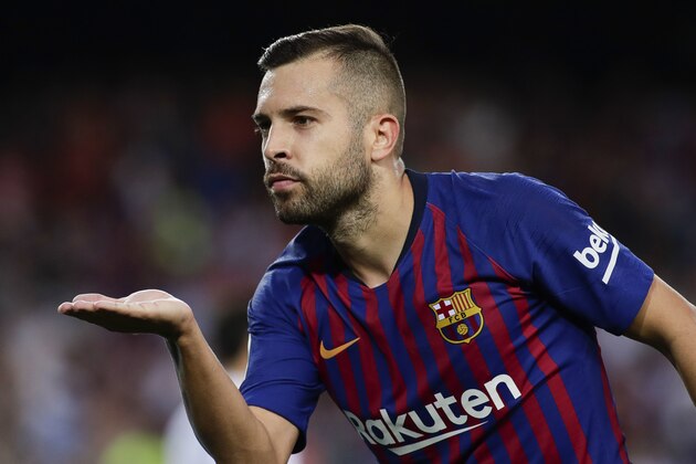 Barcelona's Jordi Alba celebrates scoring his side's seventh goal during a Spanish La Liga soccer match between Barcelona and Huesca at the Camp Nou stadium in Barcelona, Spain, Sunday Sept. 2, 2018. (AP Photo/Eric Alonso)