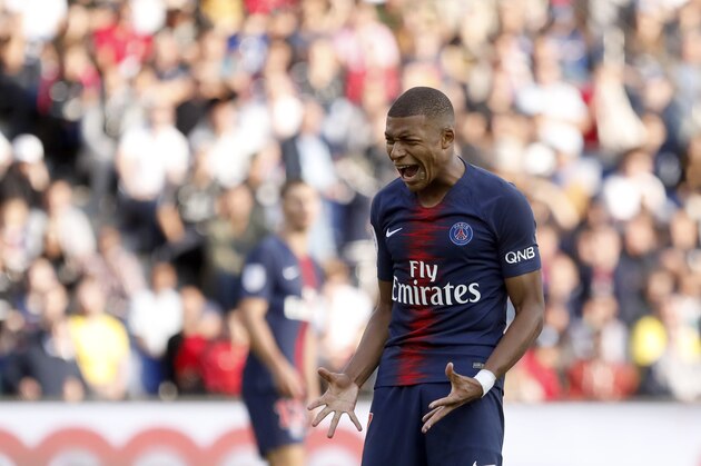 PSG's Kylian Mbappe reacts after missing a chance to score during the French League One soccer match between Paris Saint Germain and Angers at the Parc des Princes stadium in Paris, Saturday, Aug. 25, 2018. (AP Photo/Laurent Cipriani)
