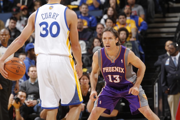 OAKLAND, CA - FEBRUARY 13: Steve Nash #13 of the Phoenix Suns prepares to defend Stephen Curry #30 of the Golden State Warriors on February 13, 2012 at Oracle Arena in Oakland, California. NOTE TO USER: User expressly acknowledges and agrees that, by downloading and or using this photograph, user is consenting to the terms and conditions of Getty Images License Agreement. Mandatory Copyright Notice: Copyright 2012 NBAE (Photo by Rocky Widner/NBAE via Getty Images)