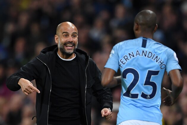 MANCHESTER, ENGLAND - MAY 09:  Josep Guardiola, Manager of Manchester City gives instruction to Fernandinho of Manchester City  during the Premier League match between Manchester City and Brighton and Hove Albion at Etihad Stadium on May 9, 2018 in Manchester, England.  (Photo by Gareth Copley/Getty Images)