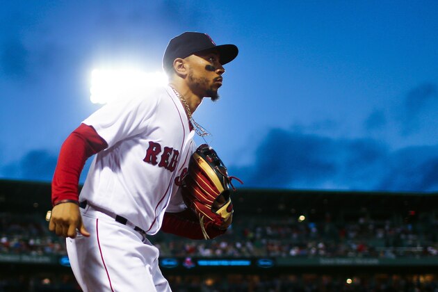 BOSTON, MA - AUGUST 21:  Mookie Betts #50 of the Boston Red Sox runs onto the field during a game against the Cleveland Indians at Fenway Park on August 21, 2018 in Boston, Massachusetts.  (Photo by Adam Glanzman/Getty Images)