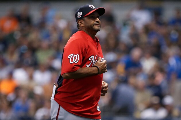 MILWAUKEE, WI - JULY 23:  Manager Dave Martinez of the Washington Nationals jogs across the field in the sixth inning against the Milwaukee Brewers at Miller Park on July 23, 2018 in Milwaukee, Wisconsin.  (Photo by Dylan Buell/Getty Images)