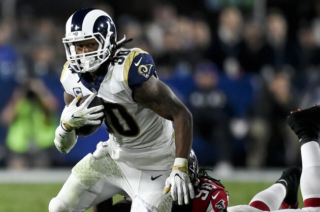 Los Angeles Rams running back Todd Gurley is tackled by Atlanta Falcons defensive end Takkarist McKinley during the second half of an NFL football wild-card playoff game Saturday, Jan. 6, 2018, in Los Angeles. (AP Photo/Kelvin Kuo)