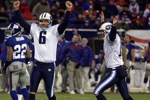 EAST RUTHERFORD, UNITED STATES:  Tennessee Titans' placekicker Joe Nedney (L) celebrates with Craig Hentrich (R) after kicking the game-winning field goal in overtime for a 32-29 victory over the New York Giants 01 December, 2002 at Giants Stadium in East Rutherford, New Jersey. AFP PHOTO/Matt CAMPBELL (Photo credit should read MATT CAMPBELL/AFP/Getty Images)