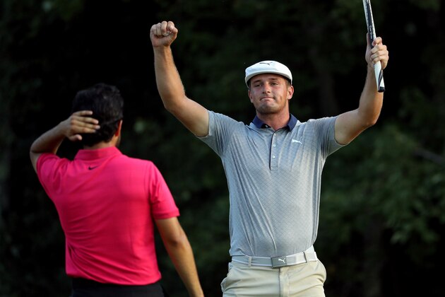 NORTON, MA - SEPTEMBER 03: Bryson DeChambeau of the United States celebrates in front of Abraham Ancer after making a par on the 18th green to win the Dell Technologies Championship at TPC Boston on September 3, 2018 in Norton, Massachusetts. (Photo by Patrick Smith/Getty Images)