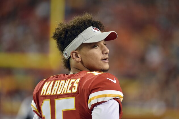 Kansas City Chiefs quarterback Patrick Mahomes (15) follows from the sidelines the first half of an NFL preseason football game against the Green Bay Packers in Kansas City, Mo., Thursday, Aug. 30, 2018. (AP Photo/Ed Zurga)