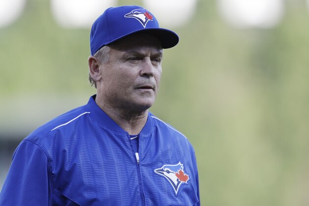 Toronto Blue Jays manager John Gibbons walks back to the dugout after visiting the mound during the third inning of a baseball game against the Detroit Tigers, Saturday, July 15, 2017, in Detroit. (AP Photo/Carlos Osorio)