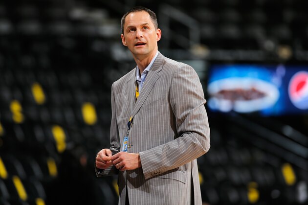 DENVER, CO - NOVEMBER 03:  Arturas Karnisovas, assistant general manager of the Denver Nuggets watches as players warm up prior tto the game between the Sacramento Kings and the Denver Nuggets at Pepsi Center on November 3, 2014 in Denver, Colorado. The Kings defeated the Nuggets 110-105. NOTE TO USER: User expressly acknowledges and agrees that, by downloading and or using this photograph, User is consenting to the terms and conditions of the Getty Images License Agreement.  (Photo by Doug Pensinger/Getty Images)