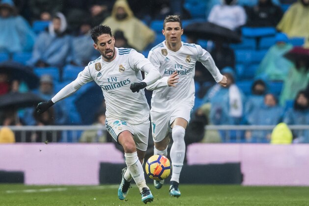 MADRID, SPAIN - JANUARY 13: Isco Alarcon and Cristiano Ronaldo of Real Madrid run for the ball during the La Liga 2017-18 match between Real Madrid and Villarreal CF at Santiago Bernabeu Stadium on January 13 2018 in Madrid, Spain. (Photo by Power Sport Images/Getty Images)