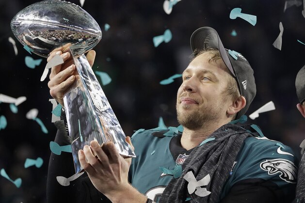 Philadelphia Eagles' Nick Foles holds up the Vince Lombardi Trophy after the NFL Super Bowl 52 football game against the New England Patriots, Sunday, Feb. 4, 2018, in Minneapolis. The Eagles won 41-33. (AP Photo/Matt Slocum)