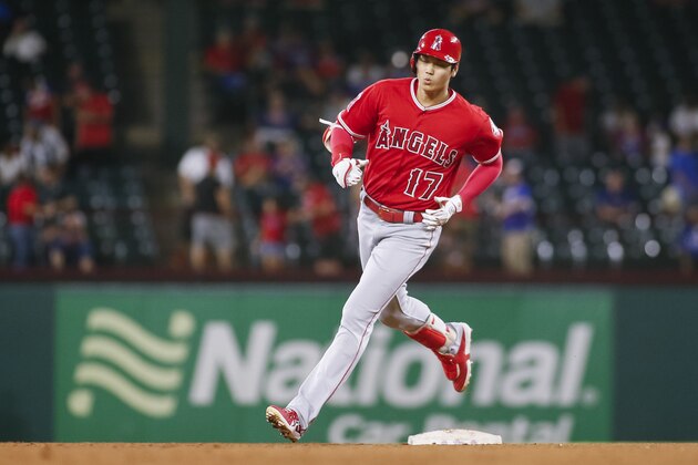 Los Angeles Angels' Shohei Ohtani rounds second base after hitting a solo home run in the fifth inning of a baseball game against the Texas Rangers, Wednesday, Sept. 5, 2018, in Arlington, Texas. (AP Photo/Ray Carlin)