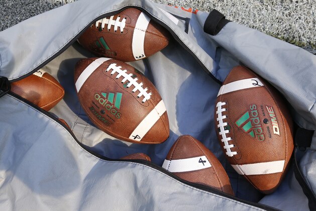 A bag of footballs are shown during warmups before the start of an NCAA College football game between Miami and Georgia Tech, Saturday, Oct. 14, 2017 in Miami Gardens, Fla. Miami defeated Georgia Tech 25-24. (AP Photo/Wilfredo Lee)