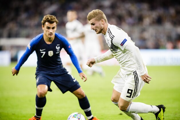 MUNICH, GERMANY - SEPTEMBER 06: Timo Werner of Germany is challenged by Antoine Griezmann of France during the UEFA Nations League group A match between Germany and France at Allianz Arena on September 6, 2018 in Munich, Germany. (Photo by Reinaldo Coddou H./Getty Images)