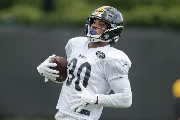 Pittsburgh Steelers running back James Conner runs with the ball during an NFL football practice, Wednesday, Sept. 5, 2018, in Pittsburgh. The Steelers franchise tagged star running back Le'Veon Bell still hasn't shown up for any practices, so it looks like Conner will continue to be the back carrying the ball when the Steelers start the regular season against the Cleveland Browns on Sunday. (AP Photo/Keith Srakocic)