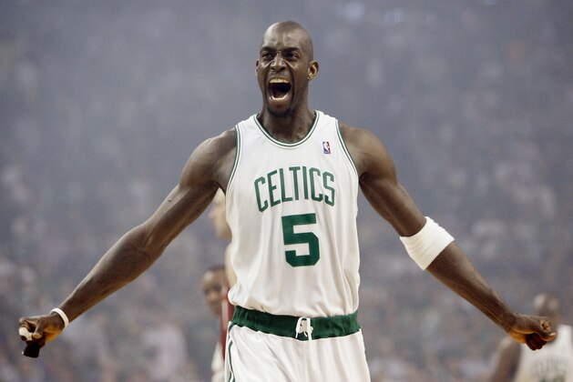 FILE - In this May 6, 2008, file photo, Boston Celtics' Kevin Garnett gestures to the crowd just before tipoff in Game 1 of an NBA Eastern Conference semifinal basketball series against the Cleveland Cavaliers in Boston. A person with knowledge of the decision tells The Associated Press that Kevin Garnett has informed the Minnesota Timberwolves that he will retire after 21 seasons. The two sides came to agreement on a buyout on Friday, Sept. 23, 2016, the person said. (AP Photo/Winslow Townson, File) FILE - In this May 6, 2008, file photo, Boston Celtics' Kevin Garnett gestures to the crowd just before tipoff in Game 1 of an NBA Eastern Conference semifinal basketball series against the Cleveland Cavaliers in Boston. A person with knowledge of the decision tells The Associated Press that Kevin Garnett has informed the Minnesota Timberwolves that he will retire after 21 seasons. The two sides came to agreement on a buyout on Friday, Sept. 23, 2016, the person said. (AP Photo/Winslow Townson, File)