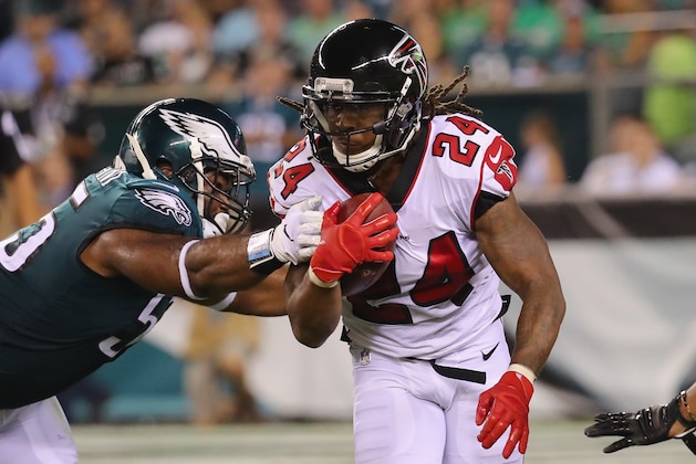 PHILADELPHIA, PA - SEPTEMBER 06:  Devonta Freeman #24 of the Atlanta Falcons is tackled by Brandon Graham #55 of the Philadelphia Eagles during the first half at Lincoln Financial Field on September 6, 2018 in Philadelphia, Pennsylvania.  (Photo by Brett Carlsen/Getty Images)