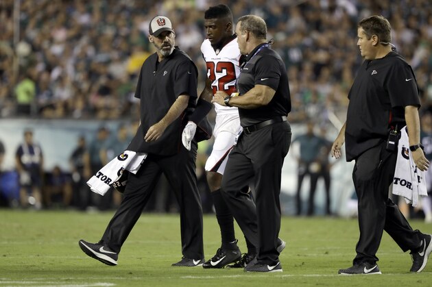 Atlanta Falcons' Keanu Neal (22) is helped off the field after an injury during the first half of an NFL football game against the Philadelphia Eagles, Thursday, Sept. 6, 2018, in Philadelphia. (AP Photo/Matt Rourke)