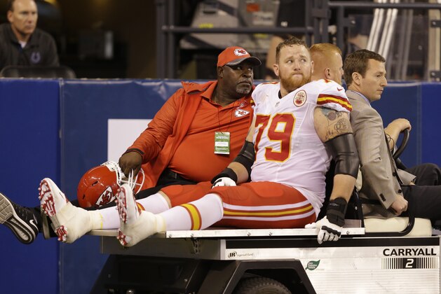 FILE - In this Oct. 30, 2016, file photo, Kansas City Chiefs' Parker Ehinger (79) is carted off the field during the second half of an NFL football game against the Indianapolis Colts, in Indianapolis. One day after four players left the game — including two Indianapolis Colts' players — with concussions, coach Chuck Pagano tried to tamp down the notion that it had something to do with the field conditions. Instead, he thought it was just an aberration.  (AP Photo/Michael Conroy, File)