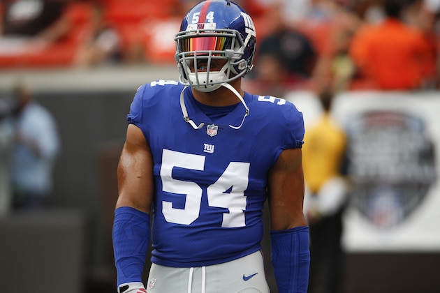 New York Giants defensive end Olivier Vernon warms up before an NFL football game against the Cleveland Browns, Monday, Aug. 21, 2017, in Cleveland. (AP Photo/Ron Schwane)