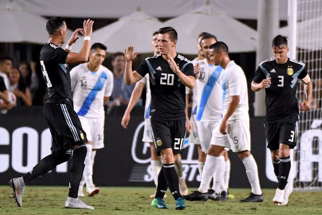 LOS ANGELES, CA - SEPTEMBER 07:  Giovani Lo Celso #20 of Argentina celebrates his goal with Ramiro Funes Mori #13 to take a 2-0 lead over Guatemala during the first half at Los Angeles Memorial Coliseum on September 7, 2018 in Los Angeles, California.  (Photo by Harry How/Getty Images)