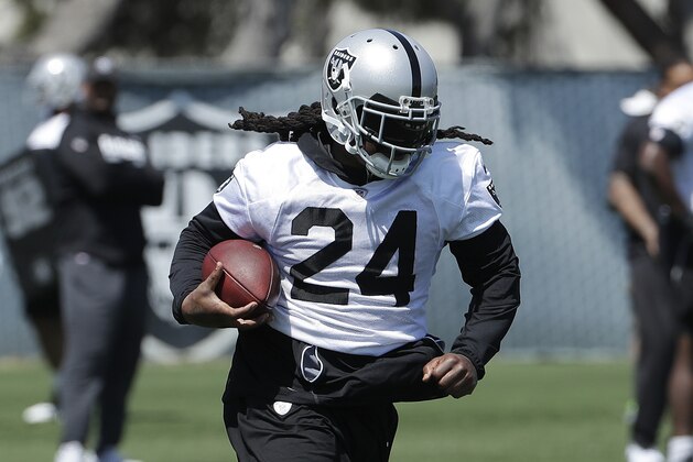 Oakland Raiders running back Marshawn Lynch runs at the team's football facility in Alameda, Calif., Tuesday, April 24, 2018. (AP Photo/Jeff Chiu)