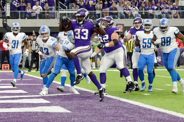 MINNEAPOLIS, MN - OCTOBER 1: Dalvin Cook #33 of the Minnesota Vikings scores a five yard rushing touchdown in the second quarter of the game against the Detroit Lions on October 1, 2017 at U.S. Bank Stadium in Minneapolis, Minnesota. (Photo by Hannah Foslien/Getty Images)