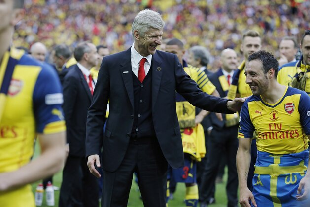 Arsene Wenger jokes with Santi Cazorla after the match during the F.A. Cup Final 2015 Aston Villa v Arsenal at Wembley Stadium on May 30th 2015 in London (Photo by Tom Jenkins/Getty Images)