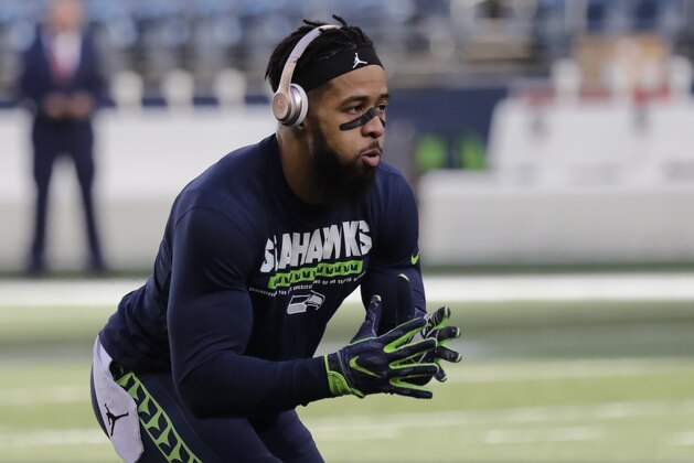 Seattle Seahawks free safety Earl Thomas warms up before an NFL football game against the Arizona Cardinals, Sunday, Dec. 31, 2017, in Seattle. (AP Photo/Elaine Thompson)