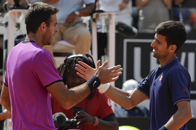 Serbia's Novak Djokovic, right, greets Argentina's Juan Martin Del Potro after winning a quarter final match at the Italian Open tennis tournament, in Rome, Saturday, May 20, 2017. (AP Photo/Gregorio Borgia)