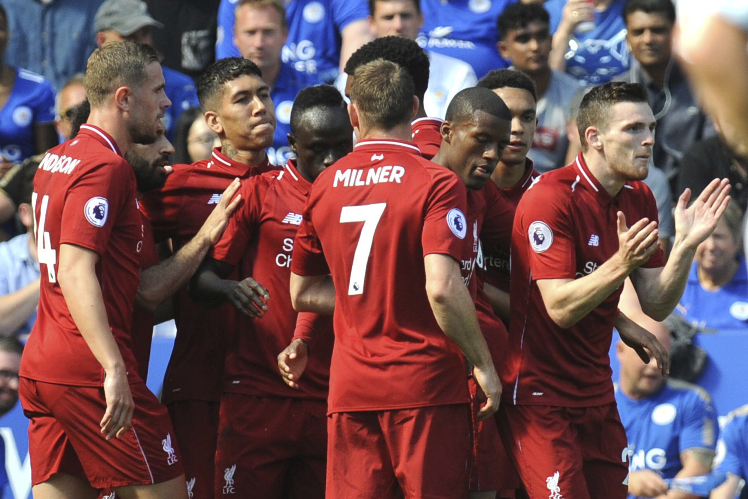 Liverpool's Sadio Mane, centre, celebrates after scoring his side's first goal with teammates during the English Premier League soccer match between Leicester City and Liverpool at the King Power Stadium in Leicester, England, Saturday, Sept. 1, 2018. (AP Photo/Rui Vieira)