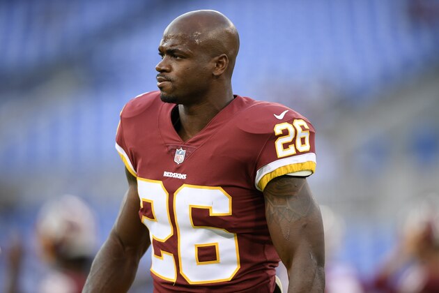 Washington Redskins running back Adrian Peterson warms up before a preseason NFL football game against the Baltimore Ravens, Thursday, Aug. 30, 2018, in Baltimore. (AP Photo/Nick Wass)