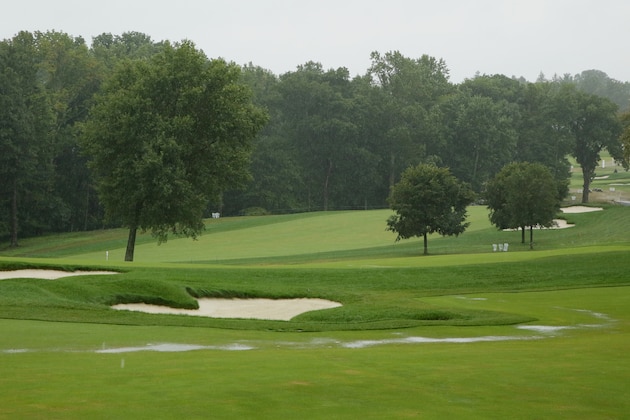 NEWTOWN SQUARE, PA - SEPTEMBER 09:  A stream of rain water runs down the 18th fairway during a weather delay prior to the final round of the BMW Championship at Aronimink Golf Club on September 9, 2018 in Newtown Square, Pennsylvania.  (Photo by Hunter Martin/Getty Images)