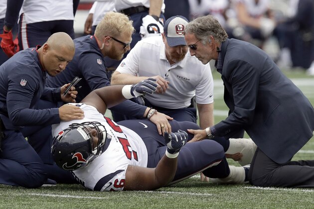 Houston Texans offensive tackle Seantrel Henderson receives attention on the field after an injury during the first half of an NFL football game against the New England Patriots, Sunday, Sept. 9, 2018, in Foxborough, Mass. (AP Photo/Charles Krupa)